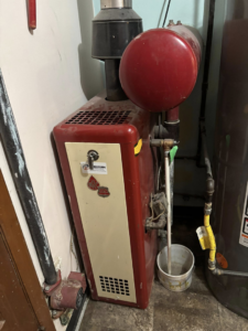 A residential boiler or furnace unit serviced by Premier HVAC/ Small appliance in Brooklyn, NY.