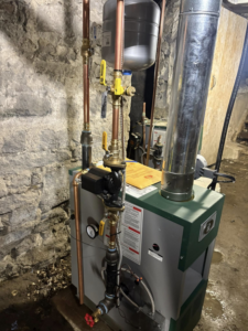 A residential boiler heating system installation with copper piping by C&A HVAC LLC in Springfield, PA.