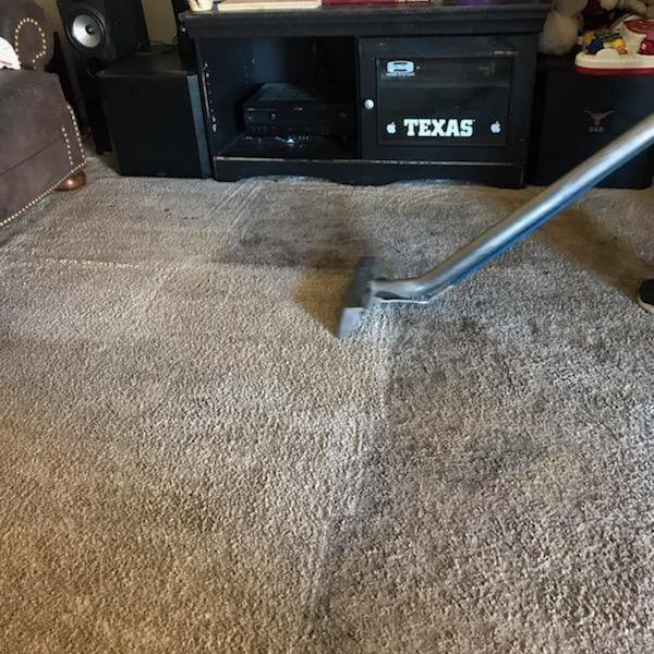 Residential carpet cleaning in progress, showing a clean strip on a light-colored carpet by C&S Carpet Cleaning in Cyril, OK.
