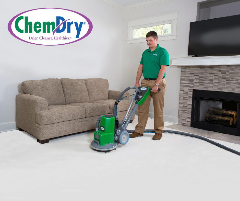 A Chem-Dry technician performing residential carpet cleaning in a living room in Alexandria, VA.