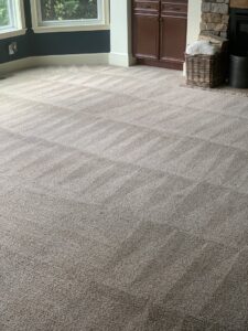 A residential room with light-colored carpet showing professional cleaning patterns by Capital City Floor Care LLC in Columbus, OH.