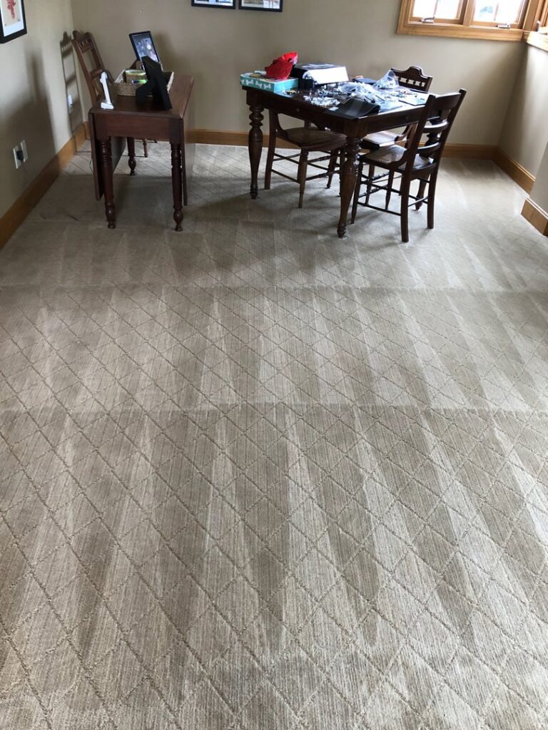 Residential carpet cleaning showing fresh patterns in a room with furniture by Fresh Step Cleaning Services in Owensboro, KY