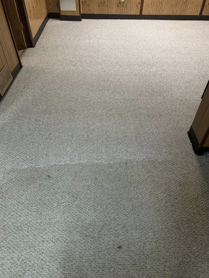 A residential room with light-colored carpet showing the clear results of a professional cleaning service by Capital City Floor Care LLC in Columbus, OH.