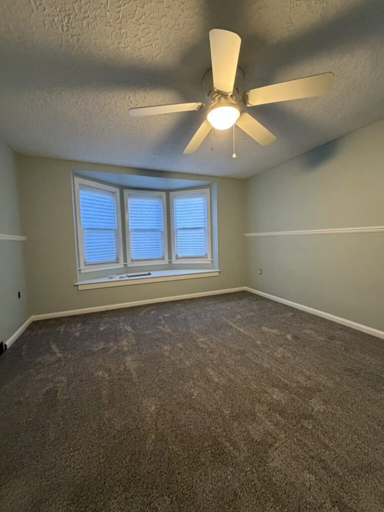 Residential gray carpet installation completed by Flooring World Wide LLC in Plainwell, MI.