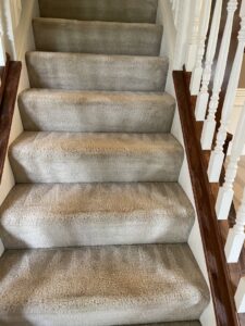 Residential carpeted stairs showing signs of foot traffic and dirt, ready for cleaning by Super Duper Carpet & Duct Cleaning in Pittsburgh, PA.