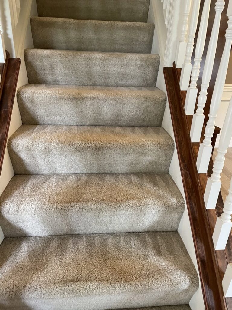 Residential carpeted stairs showing signs of foot traffic and dirt, ready for cleaning by Super Duper Carpet & Duct Cleaning in Pittsburgh, PA.