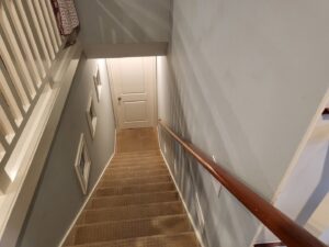 A clean, light-colored residential carpeted staircase, ready for use, by Greenco2 in Grand Rapids, MI.