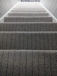 Newly installed patterned carpet on a residential staircase by LaValle Flooring Inc - Valley City in Valley City, ND.