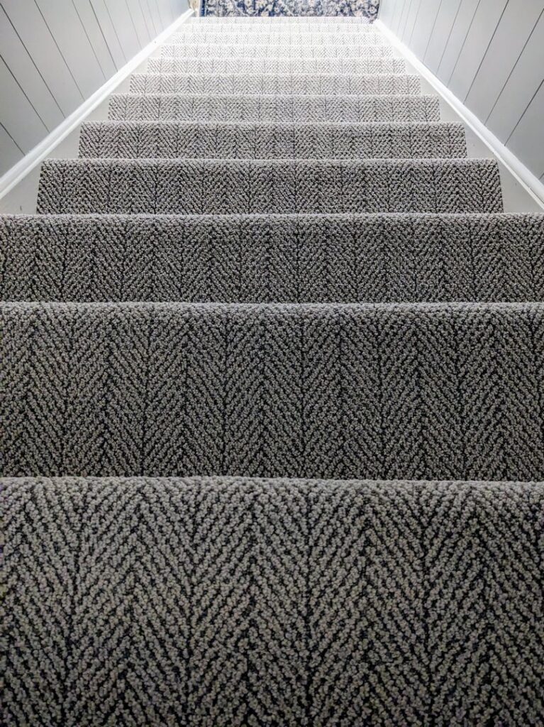 Newly installed patterned carpet on a residential staircase by LaValle Flooring Inc - Valley City in Valley City, ND.