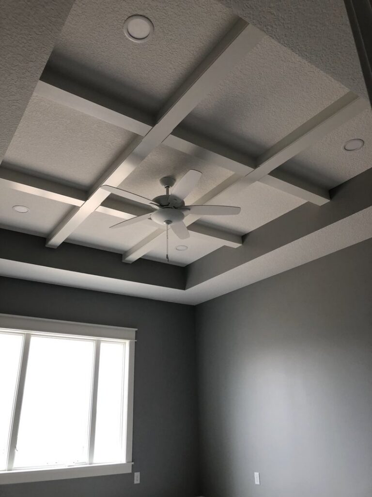 A newly installed ceiling fan and recessed lights in a residential room by Sterling Electric in Fort Wayne, IN.