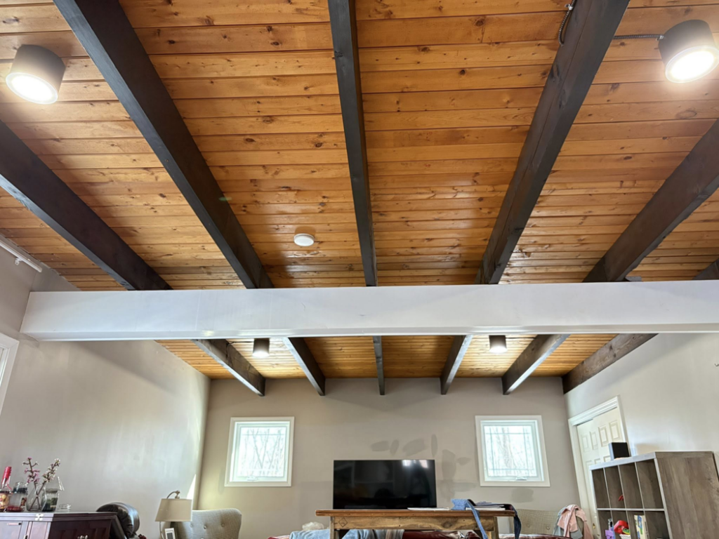 Multiple modern ceiling lights illuminating a residential room, installed by East West Electric LLC in Chester, NH.