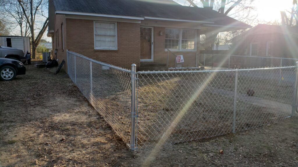 A chain-link fence installed around a residential property by Fences & Landscape Inc in Little Rock, AR.