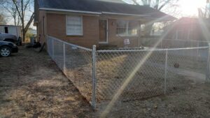 A chain-link fence installed around a residential property by Fences & Landscape Inc in Little Rock, AR.