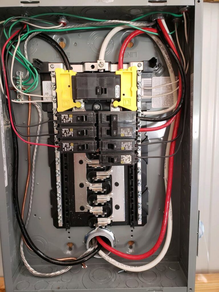 An open residential electrical breaker panel with wiring and circuit breakers by Discount Electrical Service of Franklin in Franklin, TN