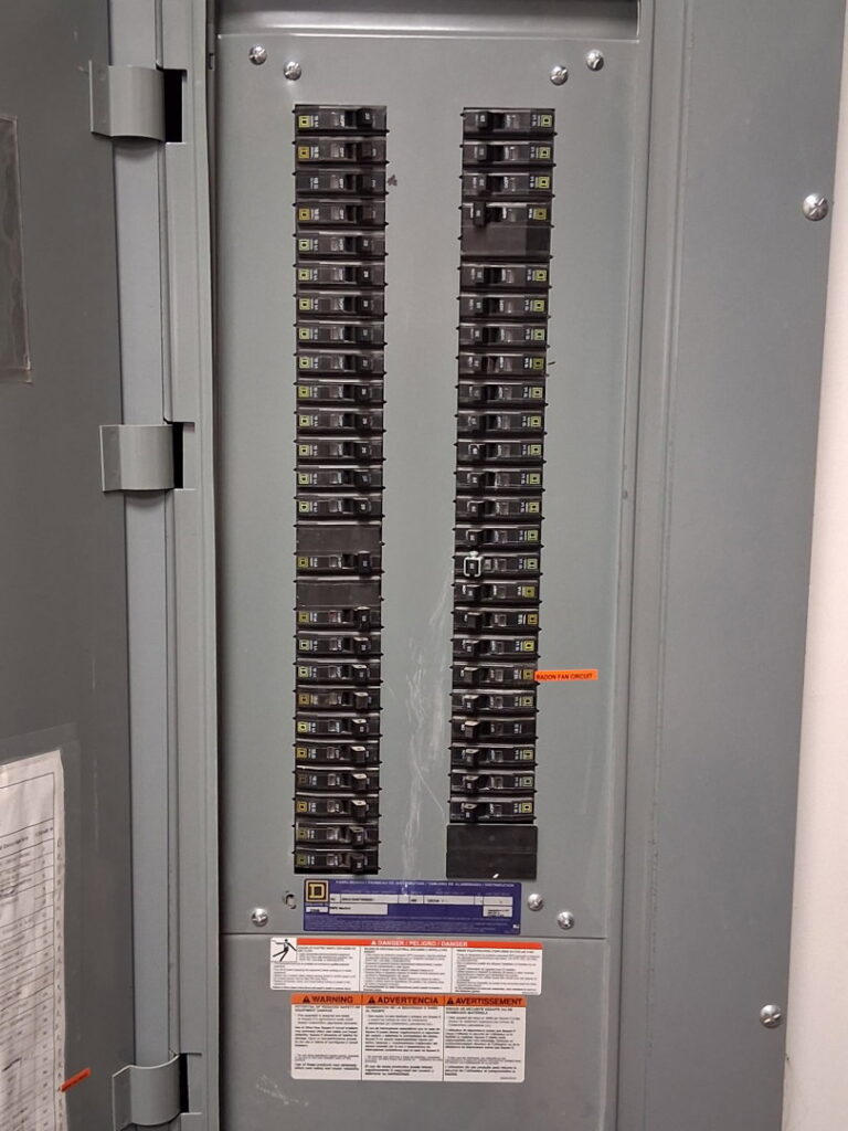 A close-up view of a modern electrical breaker panel installed by Helm Electric in Salina, KS