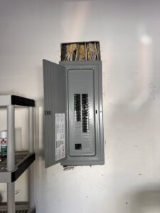 An open residential electrical breaker panel installed on a wall by Krakkom Electric in Sunrise, FL.