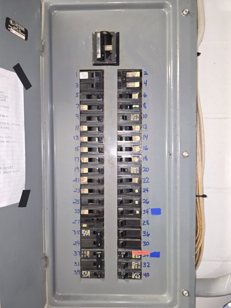 A residential electrical breaker panel with labeled circuits, serviced by Pro Circuit Electric in Peoria, IL.