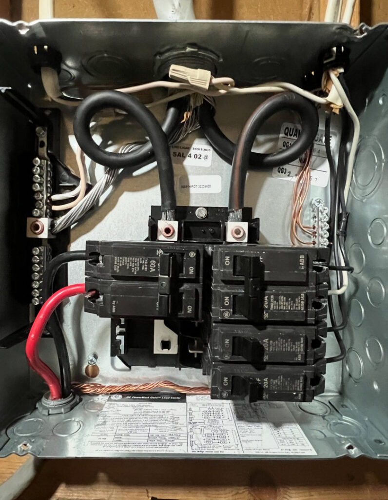 A residential electrical breaker panel with wiring and circuit breakers installed by Raschke & Sons Electric in Chattanooga, TN