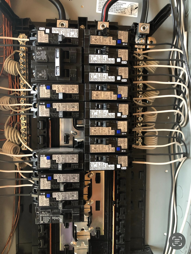 Close-up of a residential electrical breaker panel installed by Spark Electric LLC in Kenai, AK.