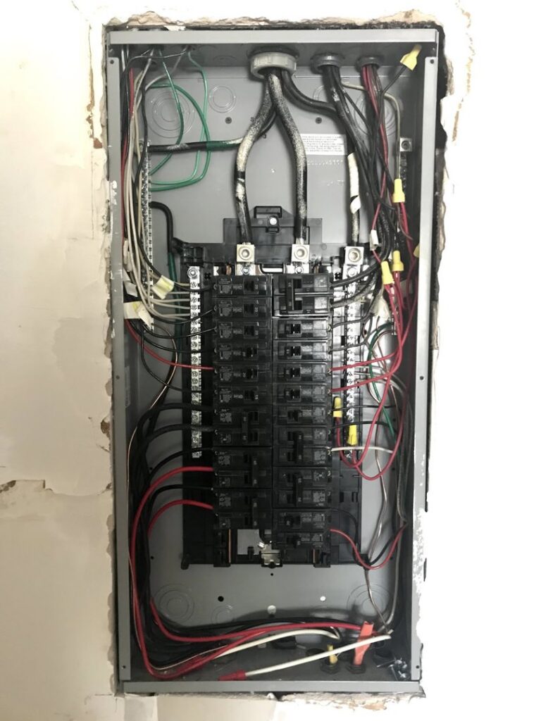 A residential electrical breaker panel with wiring installed by T-Volt, Inc. Electrical Contractor in Fort Lauderdale, FL.