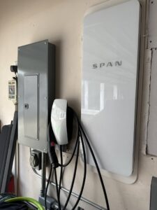 A residential electrical breaker panel with numerous wires and circuits, showcasing expert work by Volt-Pro Electric, LLC in Houston, TX