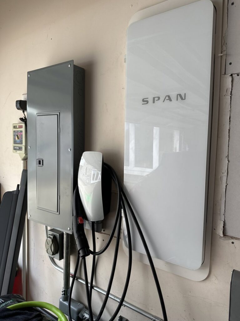 A residential electrical breaker panel with numerous wires and circuits, showcasing expert work by Volt-Pro Electric, LLC in Houston, TX