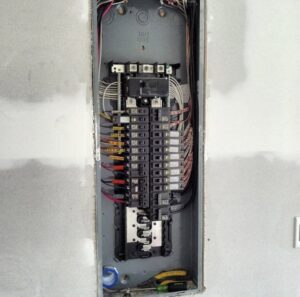An open residential electrical breaker panel with neatly wired circuits by Pierce Electric, LLC in Fayetteville, NC