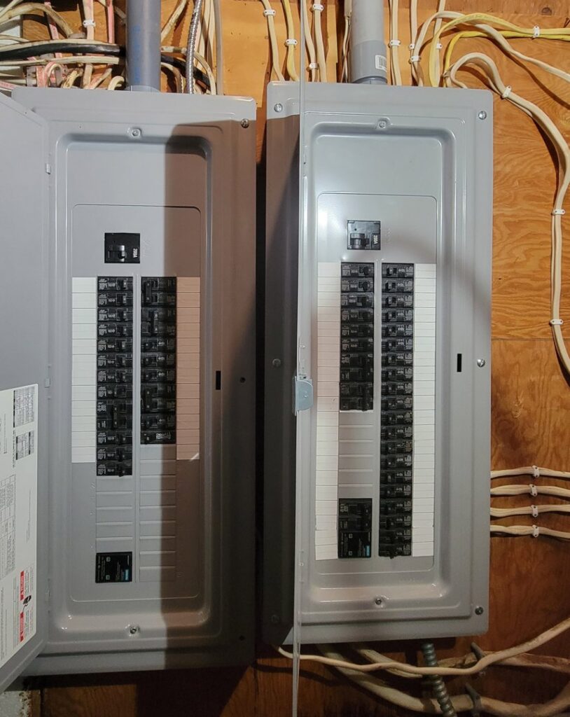 Two open residential electrical breaker panels showing wiring and circuits by John Kivel Electric, LLC in Woodbury, MN.
