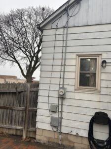 Residential electrical meter and conduit installation on a house by Advance Electrical Contractors in Milwaukee, WI.