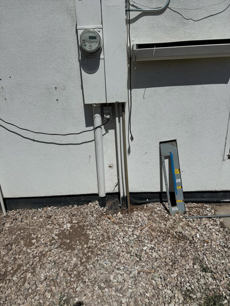 A residential electrical meter and service panel on the exterior of a home, installed by MCM Electrical Services LLC in Phoenix, AZ