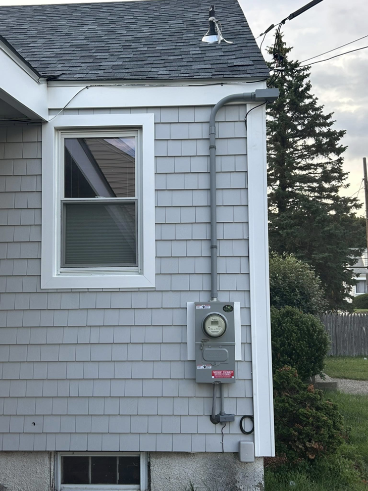 Residential electrical meter and service entrance installed by KG Electric LLC in Cumberland, RI