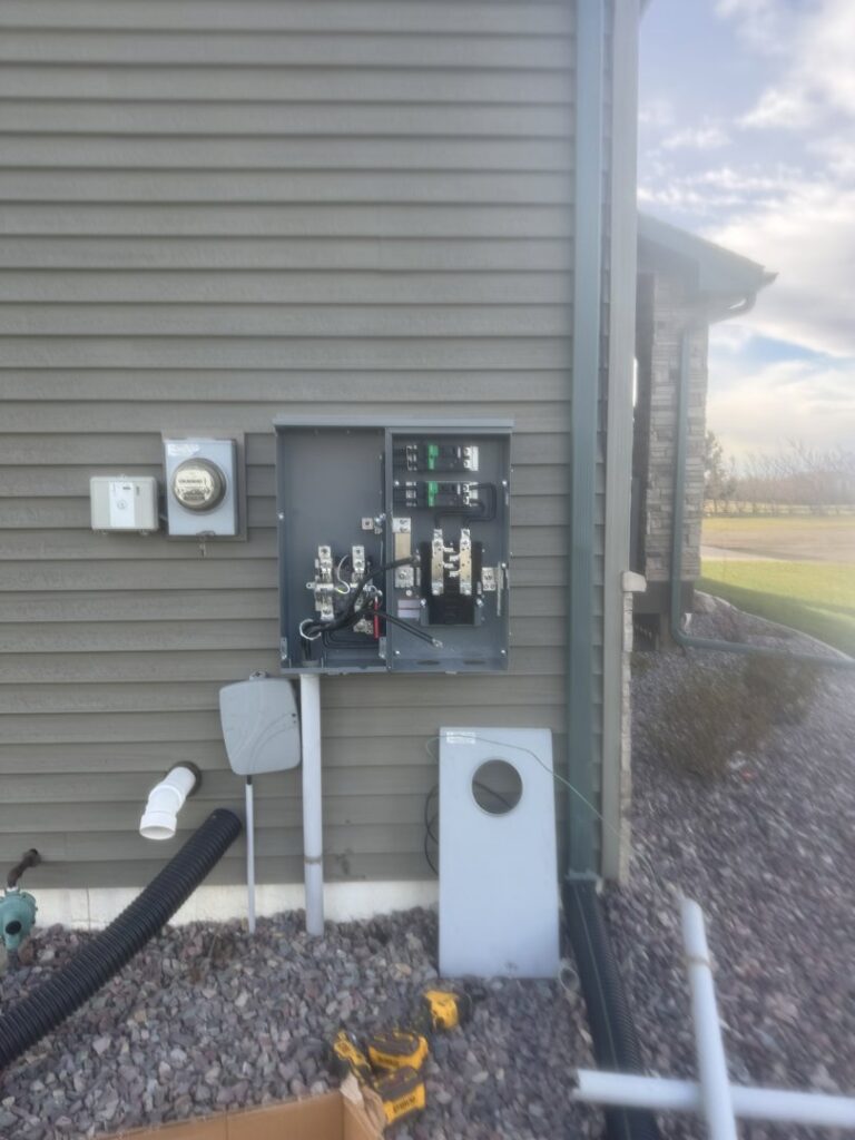 Exterior residential electrical meter and service panel installation by Apex Electrical Solutions in Minot, ND.