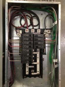 A residential electrical panel with wiring and circuit breakers installed by All City Electrical in Orlando, FL