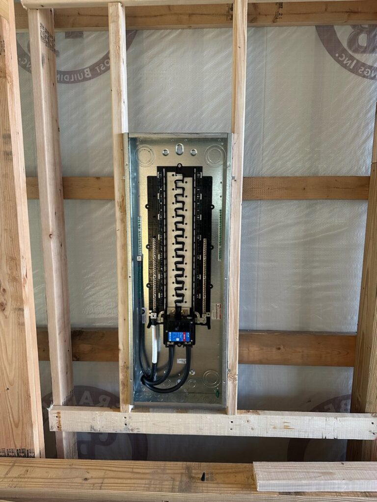 A residential electrical panel installation within wooden framing by Electric Today in Indianapolis, IN.