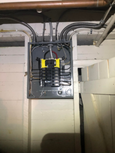 A newly installed residential electrical panel with conduit, completed by JJRS Electrical, LLC in Colorado Springs, CO.