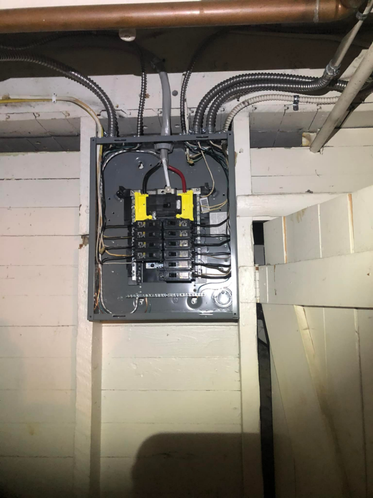 A newly installed residential electrical panel with conduit, completed by JJRS Electrical, LLC in Colorado Springs, CO.