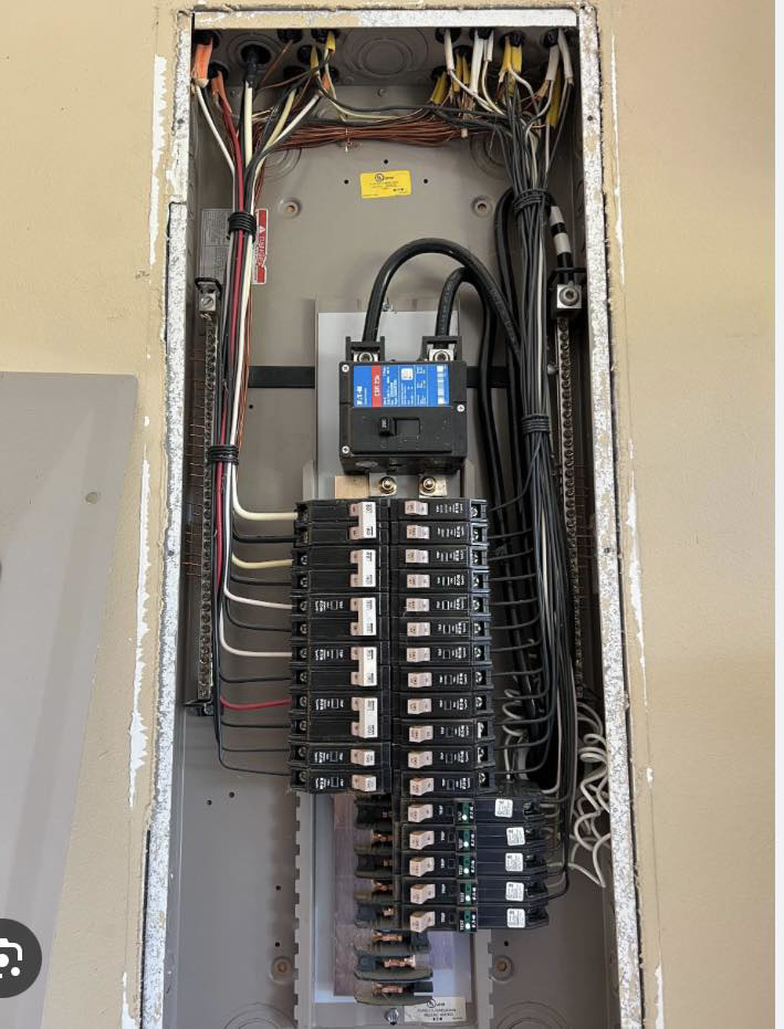 An organized residential electrical panel with circuit breakers, installed by Hilman Electric LLC in Greenville, SC.