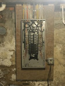 A neatly wired residential electrical panel with circuit breakers, showcasing an upgrade by RHS Electrical Services in Westerville, OH.