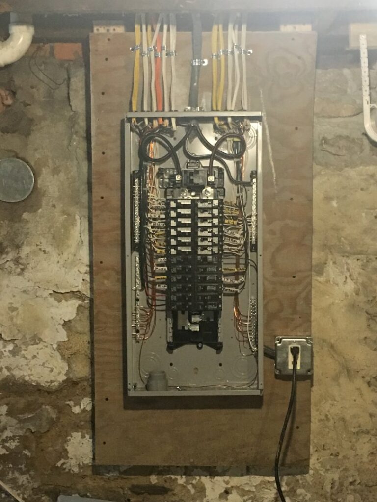 A neatly wired residential electrical panel with circuit breakers, showcasing an upgrade by RHS Electrical Services in Westerville, OH.