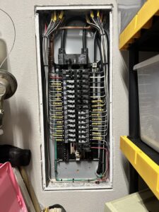 An organized residential electrical panel with circuit breakers and wiring installed by Babcock Electric & Communications in Lake Charles, LA.