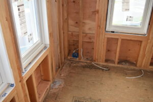 Rough-in electrical wiring and outlet boxes installed in a residential framed wall by Cardinal Electric in Sayreville, NJ