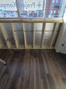 Electrical wiring and junction boxes installed in wooden wall framing during a residential project by DHJ Electric in Methuen, MA.