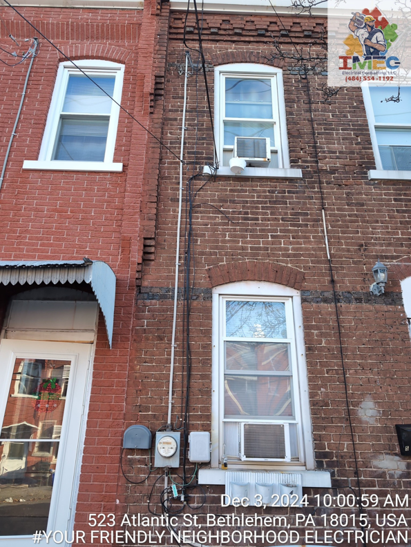 Residential electrical service line and meter on the exterior of a brick home by Imecpower in Bethlehem, PA.