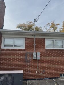 Residential electrical service entrance with masthead and conduit installed by Electric R US LLC in Dearborn, MI.