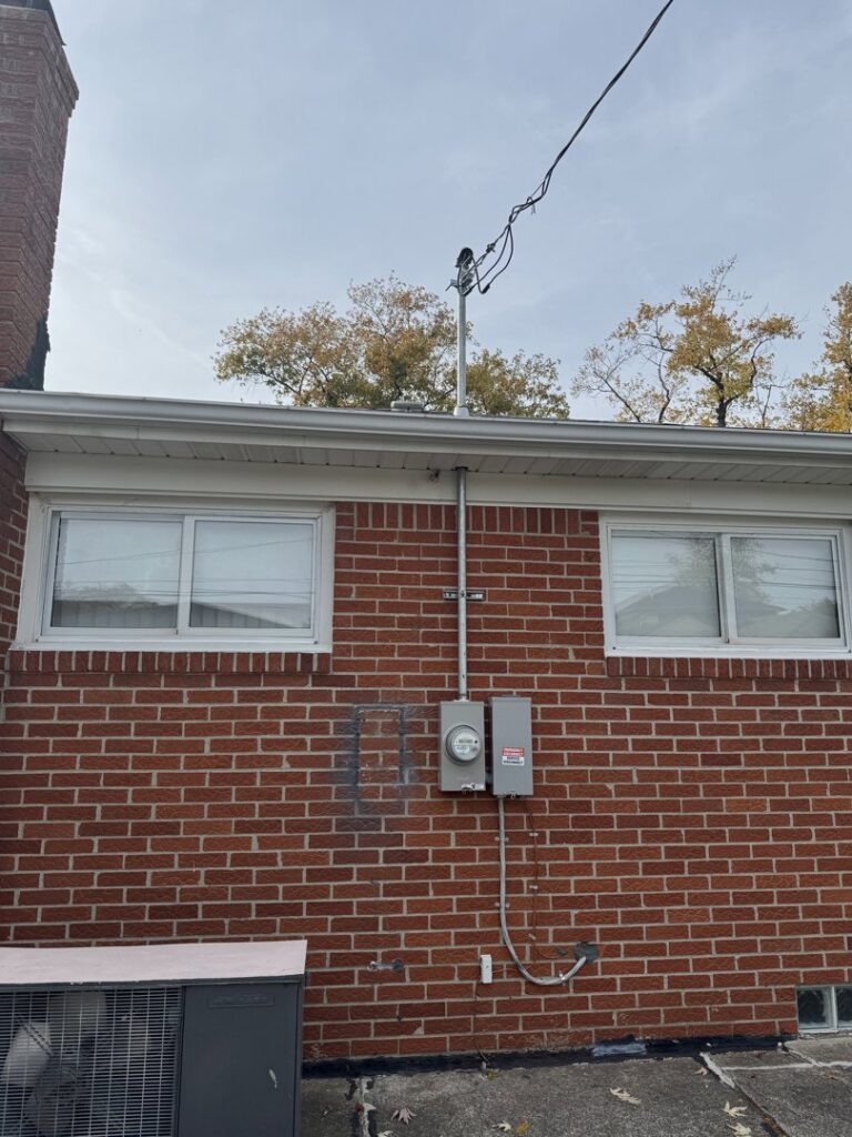Residential electrical service entrance with masthead and conduit installed by Electric R US LLC in Dearborn, MI.