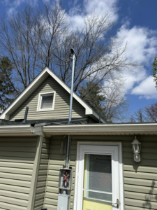 A residential electrical service upgrade with new conduit and meter box installed by Heritage Electric LLC in Indianapolis, IN.