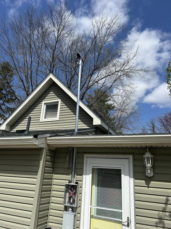 A residential electrical service upgrade with new conduit and meter box installed by Heritage Electric LLC in Indianapolis, IN.