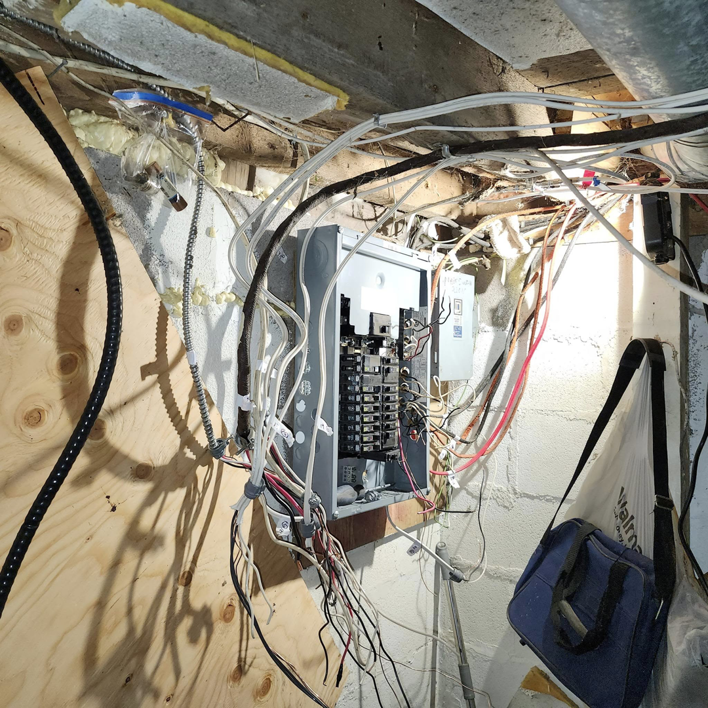 Complex residential electrical wiring connected to an open panel, demonstrating work by SEL Electric in Truro, NS.
