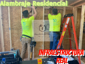 Residential electricians installing wiring and infrastructure on a wooden wall at Millan Electric Service llc in Las Vegas, NV