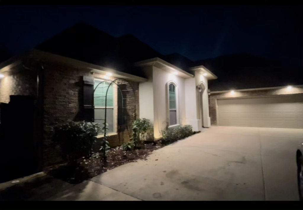 Residential exterior lighting installation showcasing a brightly lit home by Light of the World Electric in Lake City, FL.